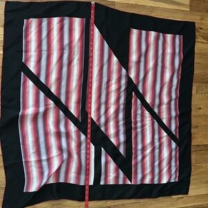 Gently used large square silk scarf.  Colorful and can be worn with many outfits